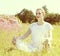 Glowing young yoga woman contemplating to meditate, sunny retro effects
