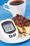 Glucometer with bad result sugar level and fresh baked cheesecake with coffee. Dieting during diabetes