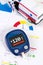 Glucometer for diabetes on medical health report