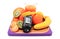 Glucometer, fresh fruits with tape measure and glass of juice