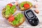 Glucometer and freshly sandwiches with paste of avocado, diabetes, healthy food and nutrition