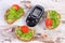 Glucometer and freshly sandwiches with paste of avocado, diabetes, healthy food and nutrition