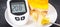 Glucometer with high sugar level and creamy fruit cake with jelly. Nutrition during diabetes. Delicious dessert for different