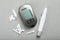 Glucometer, lancet pen and strips on grey table, flat lay. Diabetes testing kit