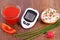Glucometer with result of sugar level and freshly sandwich with cottage cheese and vegetables
