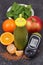 Glucometer with result sugar level and healthy smoothie from fruits and vegetables as source vitamins and minerals