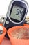 Glucometer with sugar level and fresh baked chocolate muffins. Delicious dessert for diabetics