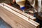 Gluing boards in a carpentry workshop. Connecting with dowels and glue. Manufacturing of furniture boards and countertops