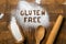 Gluten free baking concept - text with kitchen utencils, eggs, milk, butter