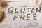 Gluten free concept. Wooden table with flour and pastry material,