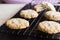 Gluten free homemade oatmeal cookies on cooling rack, horizontal