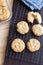 Gluten free homemade oatmeal cookies and napkin on cooling rack.