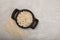 Gluten-free italian pasta products pipe rigate, vermicelli made from rice flour in wooden serving platter. Top view, grey