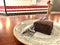Gluten Free and Sugar Free Chocolate Flourless Cake Cooked with Almond Flour served at Cafe Shop in Plate Fork and Knife