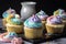 gluten-free and vegan cupcakes, frosted with swirls of pastel colors