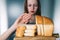 Gluten intolerance and diet concept. Young girl refuses to eat bread