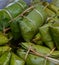 Glutinous rice steamed in banana leaf in steam pot