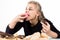 Glutton woman eating cupcakes with frenzy after long diet