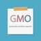 GMO Genetically Modified Organisms written in a notebook paper
