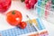 GMO tomatoes, syringe, test tubes in laboratory on periodic table.