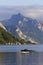 GMUNDEN, AUSTRIA, 28 May, 2023: Beautiful motorboat on Traunsee Lake, with Traunstein Mountain in background. Austria, Europe.