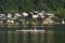 GMUNDEN, AUSTRIA, 28 May, 2023: A racing shell with 4 rowers on Traunsee Lake, Traunstein Mountain in background. Austria.