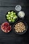 Gnarly garlic brussels ingredients, on black wooden table, top view