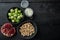 Gnarly garlic brussels ingredients, on black wooden table, top view with space for text