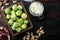 Gnarly garlic brussels ingredients, on old wooden table, top view