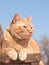 Gnger tabby cat resting on a wooden step