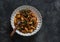 Gnocchetti pasta with bolognese sauce and spinach on a dark background, top view. Delicious comfort food