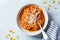 Gnocchetti sardi pasta in tomato sauce with cheese gray background. Italian pasta concept