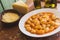 Gnocchi bolognese, cheese and olive oil on a rustic table