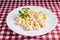 GNOcchi COOKED IN A WHITE PLATE ON A CHECKED TOWEL