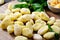 Gnocchi, Fresh Uncooked Potato Gnocchi on Wooden Board, Italian Cuisine