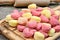 Gnocchi hearts on a cutting board with rolling pin