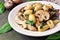 Gnocchi with mushroom sauce, spinach & chicken, close up