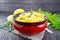 Gnocchi pumpkin with lemon in bowl on wooden table