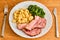 Gnocchi with smoked meat and spinach