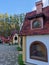 Gnome village in attraction park. Tiny dwarf houses with colorful facades. Fairy tale village and entertainment park for kids