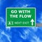 GO WITH THE FLOW road sign against clear blue sky