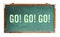 `Go! Go! Go!â€ motivational text word message written on a wide green old grungy vintage wooden chalkboard