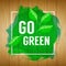 Go green concept. Nature background. Go green design concept. Wood background with paint splash, leaves and go green text. Vector