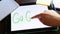 Go green - hand write text on tablet