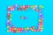 GO inscription made of colorful cube beads with letters. Festive blue background concept with copy space