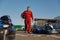 Go-kart driver walking to car before race at starting line