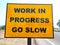 Go slow work in Progress sign board beside roads