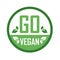 Go Vegan stamp symbol- Vegetarian food safety logo with green leaves