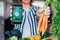 Go vegan. Woman holding a phone with active online mobile app of Vegan diet program and fresh carrots. New Start of a