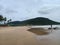 Goa beach with amazing greenish mountains and stones,rocks and continuous shops